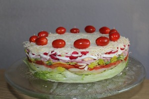 a cake made of salad ingredients